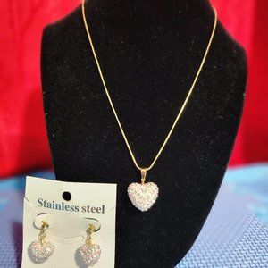 Beautiful and elegant heart necklace and earrings with pink rhinestones.
